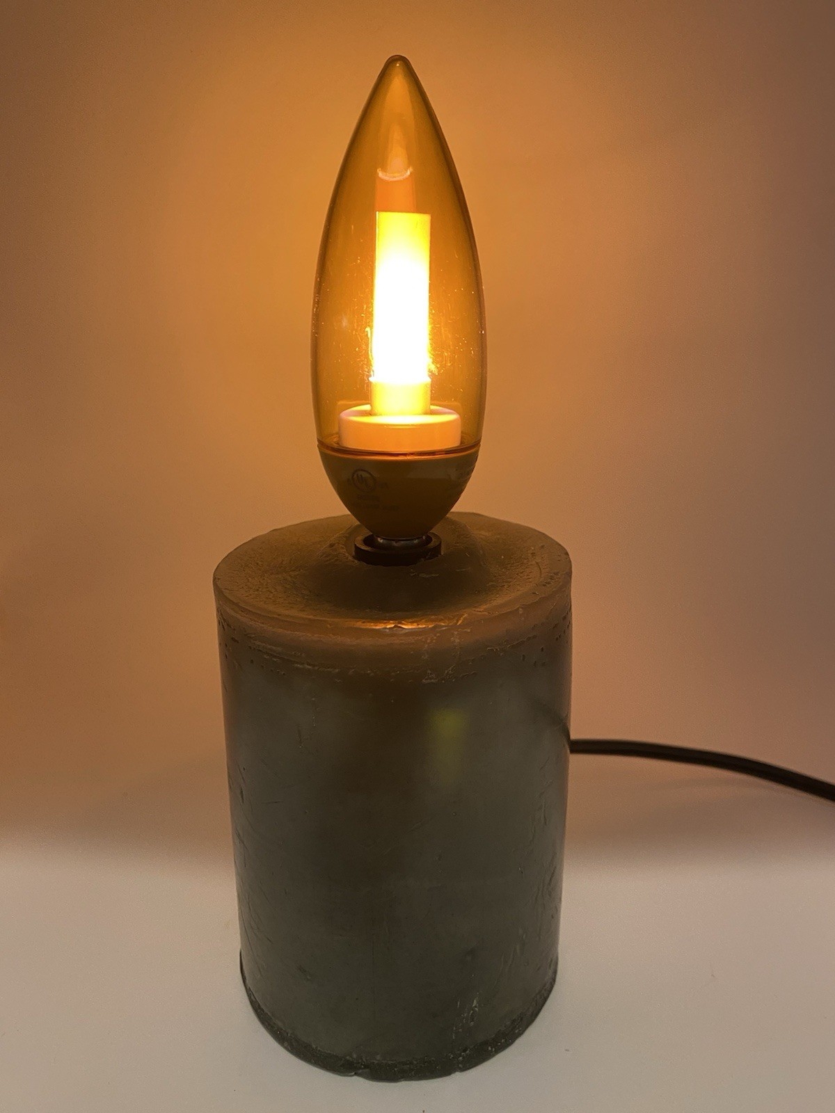 Green Wax Pillar Candle With Gold Flicker Flame Bulb, Corded, On/Off Switch, 8”