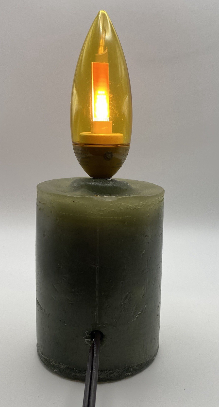 Green Wax Pillar Candle With Gold Flicker Flame Bulb, Corded, On/Off Switch, 8”