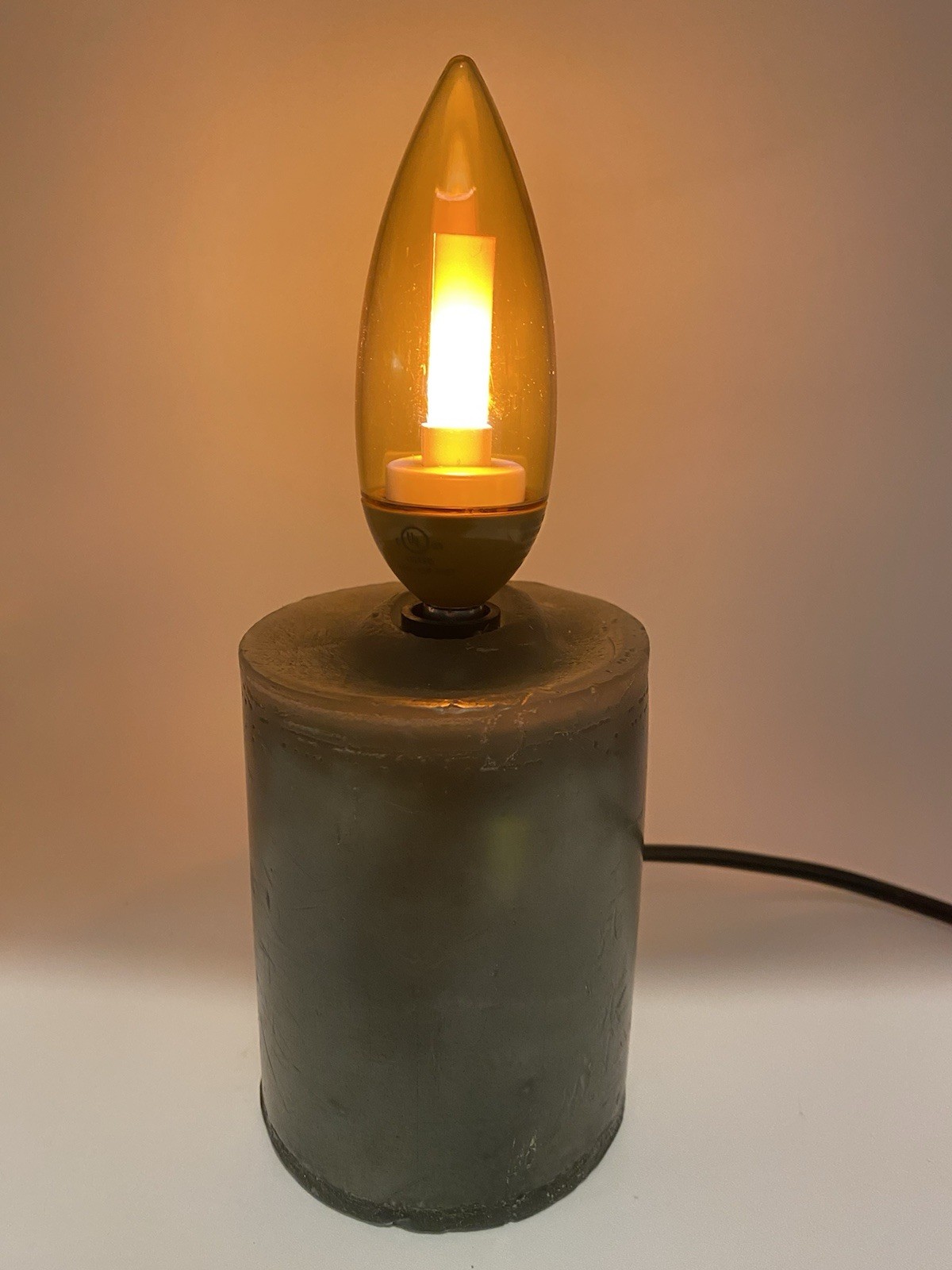 Green Wax Pillar Candle With Gold Flicker Flame Bulb, Corded, On/Off Switch, 8”