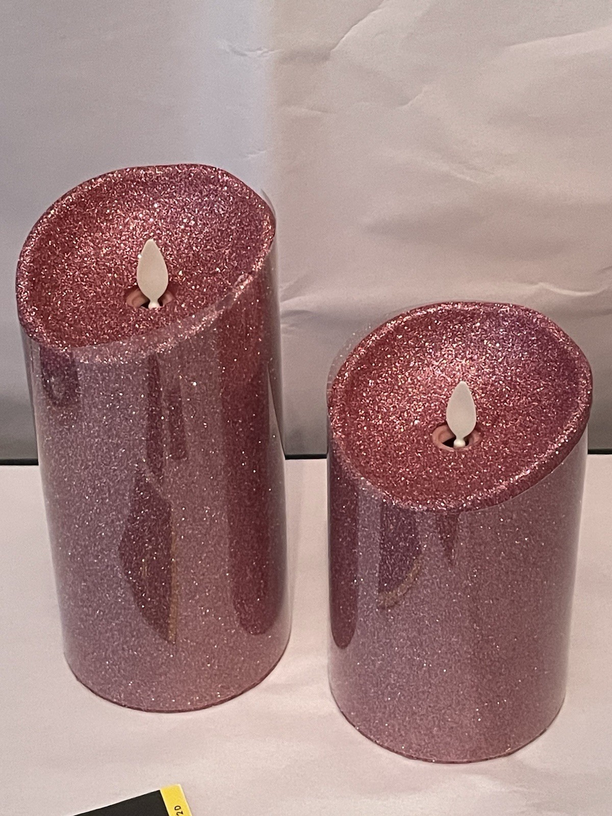 Luminara Flameless 5″ & 7″ Pink Glitter 2 pack Candle Set Timers and one remote