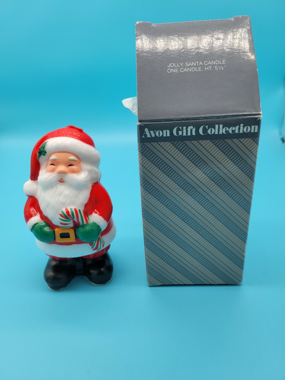 Avon Vintage1986 Jolly Santa Candle 5 1/2 ” Tall Holding Candy Cane. NEW IN ORIG