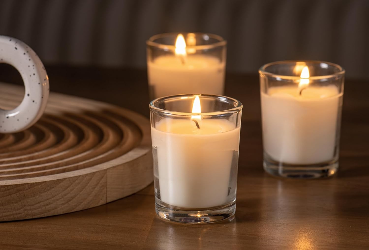24-pack Warm White Unscented Clear Glass Cup Votive Candles.