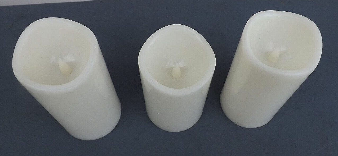 3 IVORY CANDLES FLICKER FLAME – EACH USE 3 AAA BATTERIES -1 @ 5″ & 2 @ 5 3/4″ HI