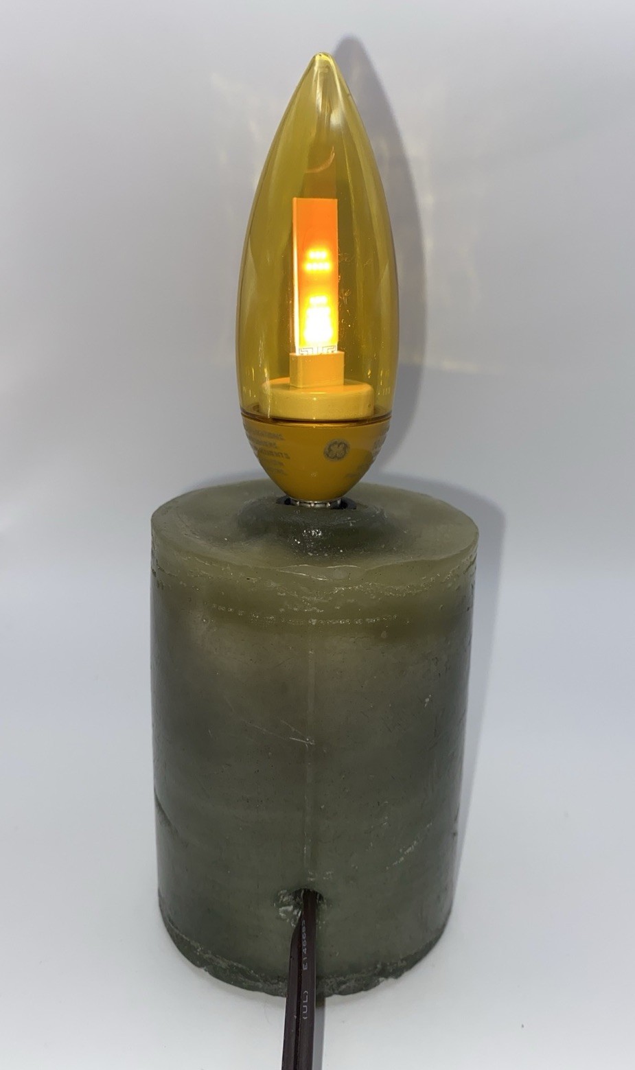 Green Wax Pillar Candle With Gold Flicker Flame Bulb, Corded, On/Off Switch, 8”