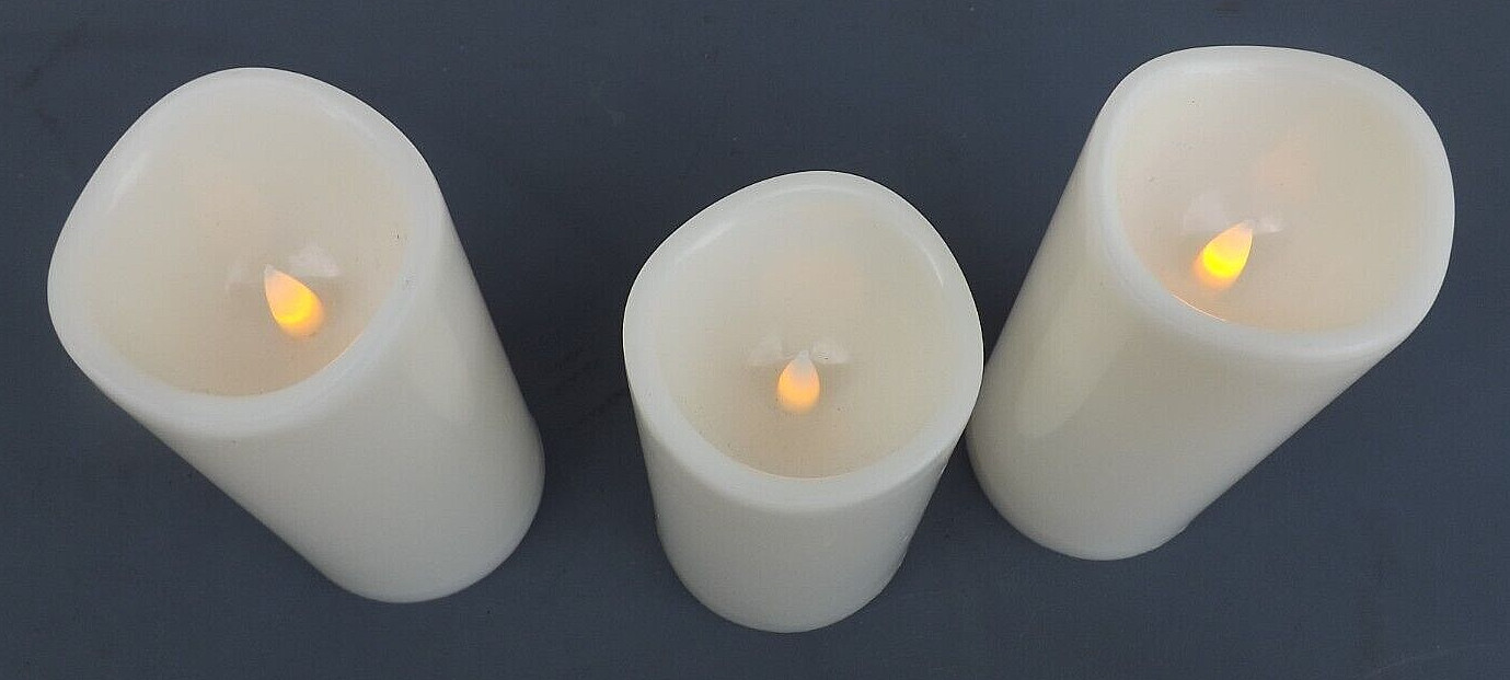 3 IVORY CANDLES FLICKER FLAME – EACH USE 3 AAA BATTERIES -1 @ 5″ & 2 @ 5 3/4″ HI