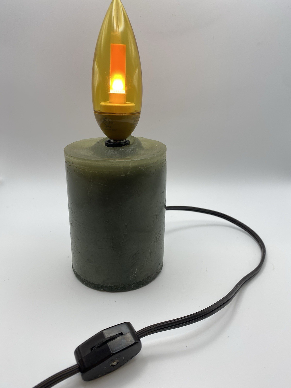 Green Wax Pillar Candle With Gold Flicker Flame Bulb, Corded, On/Off Switch, 8”