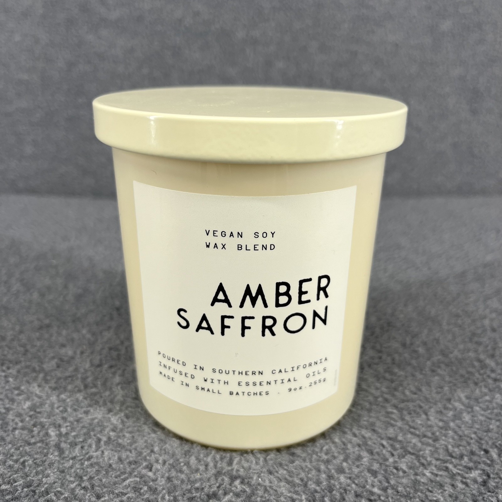 Leoben Co Amber & Saffron Vegan Soy Wax Blend Candle 9 oz beige glass