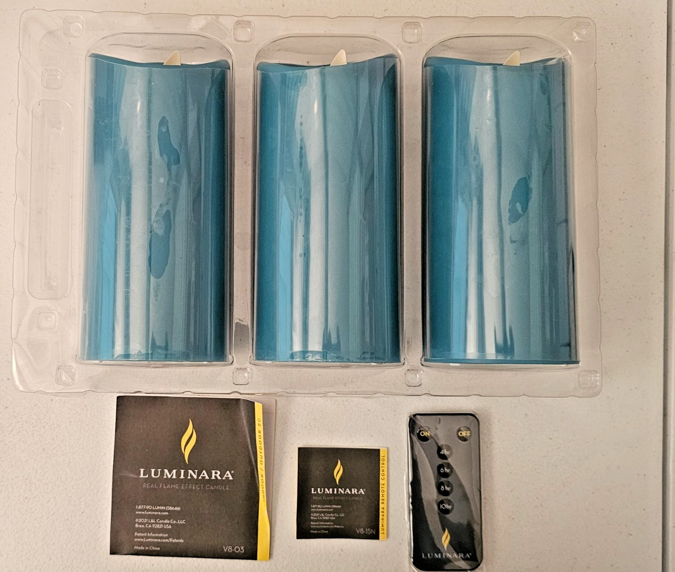 Set of 3 Luminara 360 Degree Teal Colored Remote Ctrl 3″ X7″ Pillar Candles